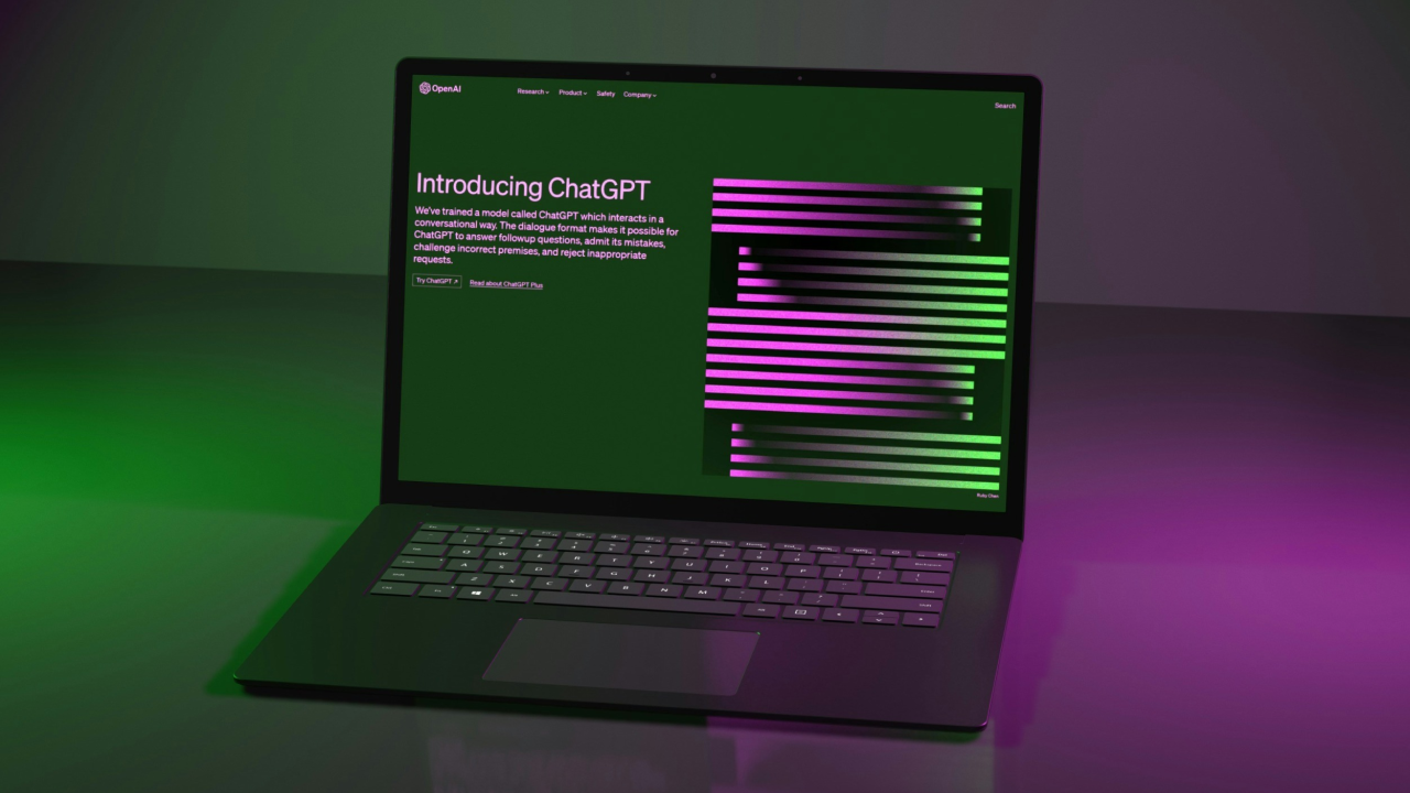 OpenAI's ChatGPT website on laptop with "Introducing ChatGPT" heading, "Try ChatGPT" button, colourful theme.